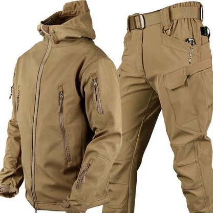 Sand-coloured hooded jacket with zipped pockets and matching belted cargo trousers, shown side by side against a white background. 2