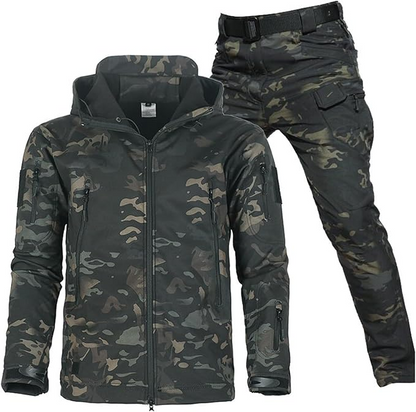 Dark camouflage hooded jacket and matching camouflage cargo trousers with black belt, in green, brown and black patches. 5