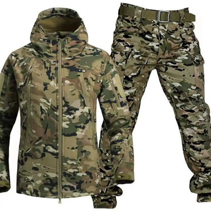 Woodland camouflage jacket with hood and matching cargo trousers with olive webbing belt, in green, tan and black patterning. 6