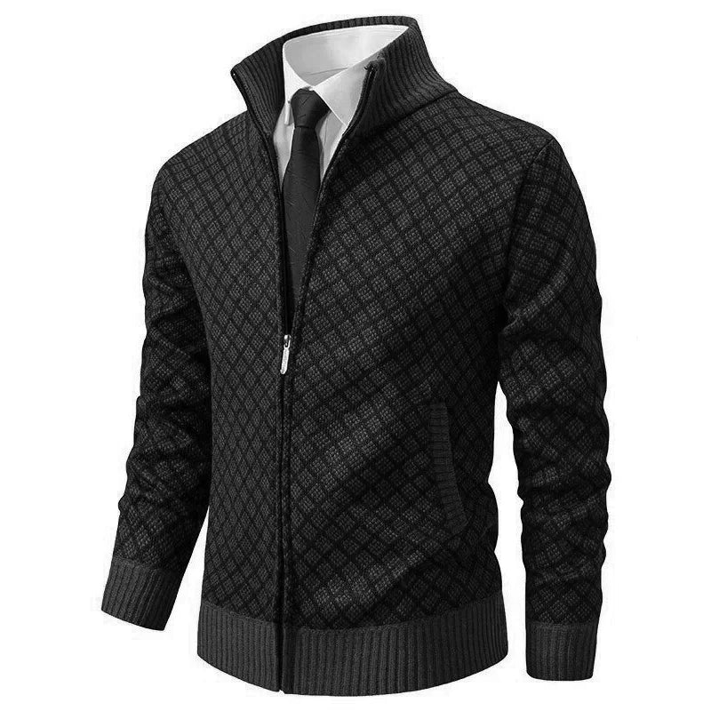 Black diamond-patterned zip cardigan with grey ribbed cuffs and hem, styled over a white shirt and tie 1