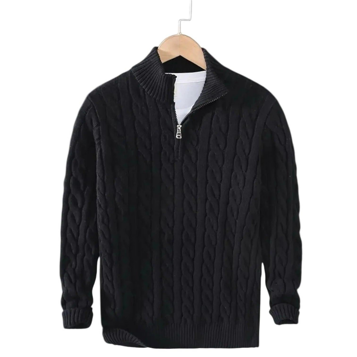 Black cable knit jumper on a wooden hanger, showing the short silver zip and ribbed mock neck 2