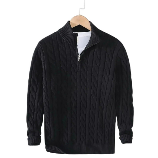 Black cable knit jumper on a wooden hanger, showing the short silver zip and ribbed mock neck 2