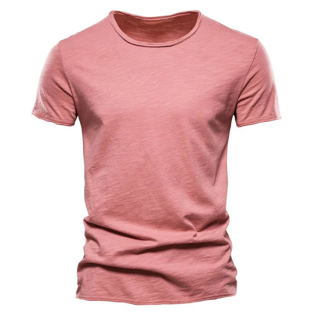 Front view of the short-sleeved crew neck t-shirt in dusty pink, showing the slub yarn texture and raw-edged sleeves. 7