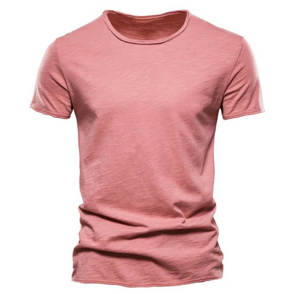 Front view of the short-sleeved crew neck t-shirt in dusty pink, showing the slub yarn texture and raw-edged sleeves. 7