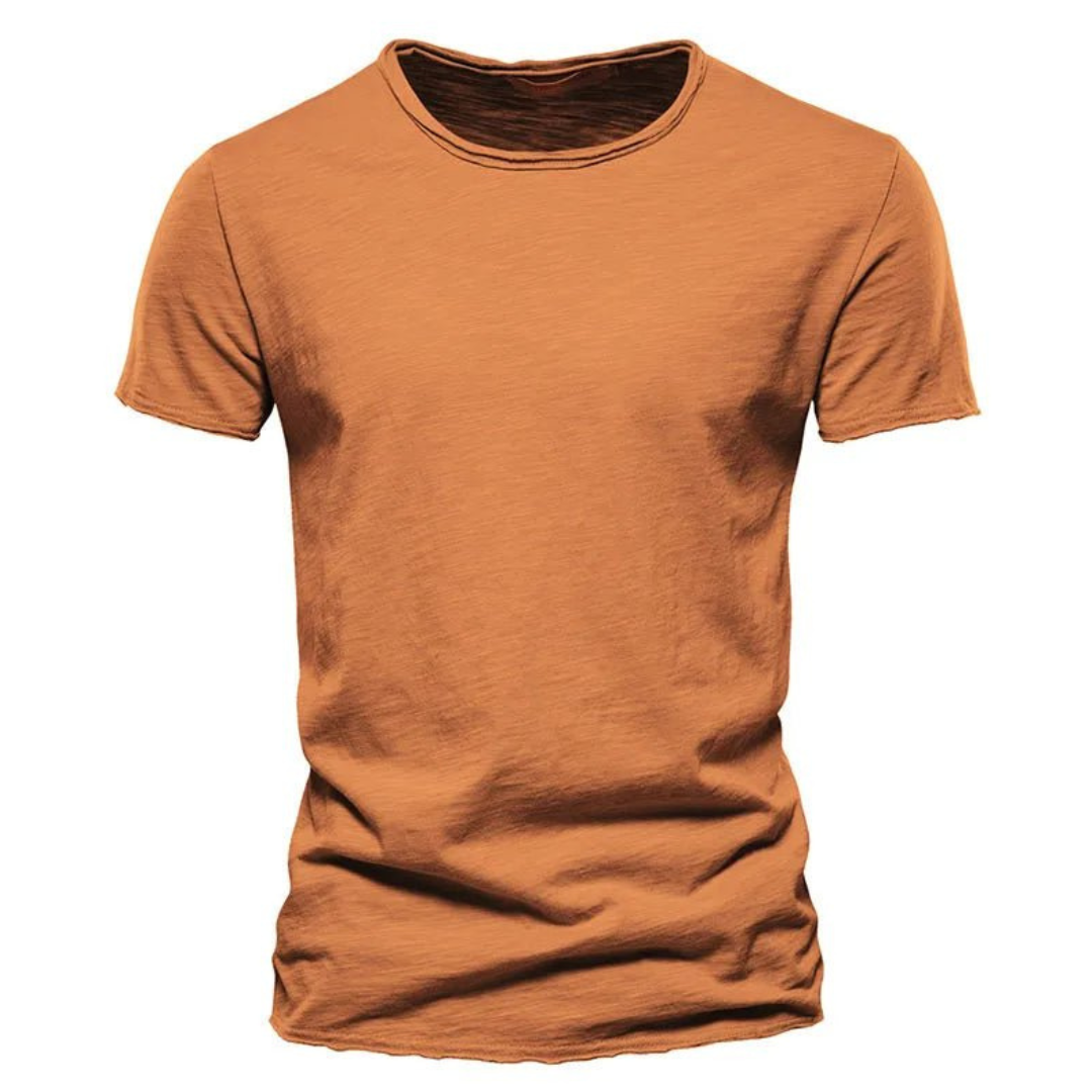 Front view of the short-sleeved crew neck t-shirt in burnt orange, showing the streaky slub texture and raw-edged hems. 8