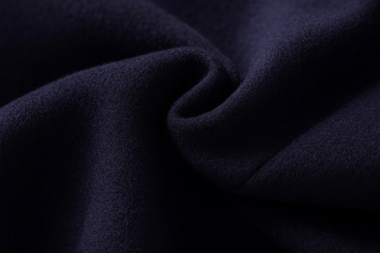 Close-up of the soft, dense navy wool blend fabric in gentle folds 11