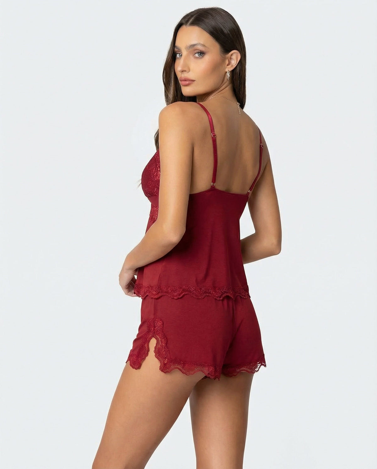 Back view of the red set as the model looks over her shoulder, with side-slit shorts 7