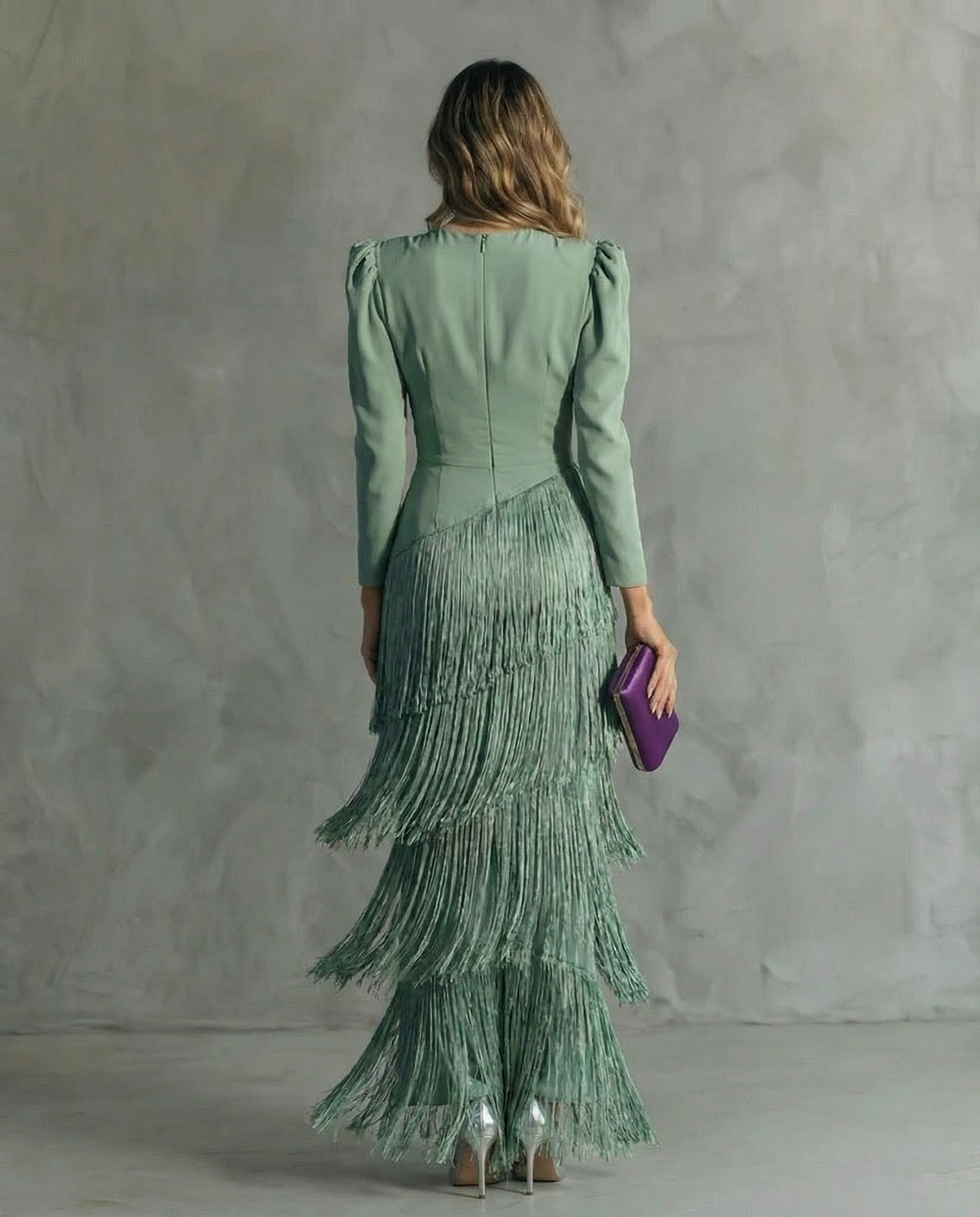 Back view of the sage green dress, showing the zip fastening and tiers of fringe 4