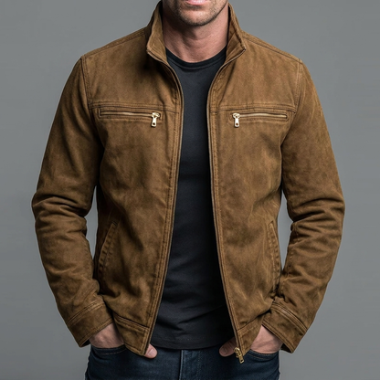 Man wearing the jacket in a brown suede-look finish with gold-toned zips, open over a black t-shirt, hands in pockets. 5
