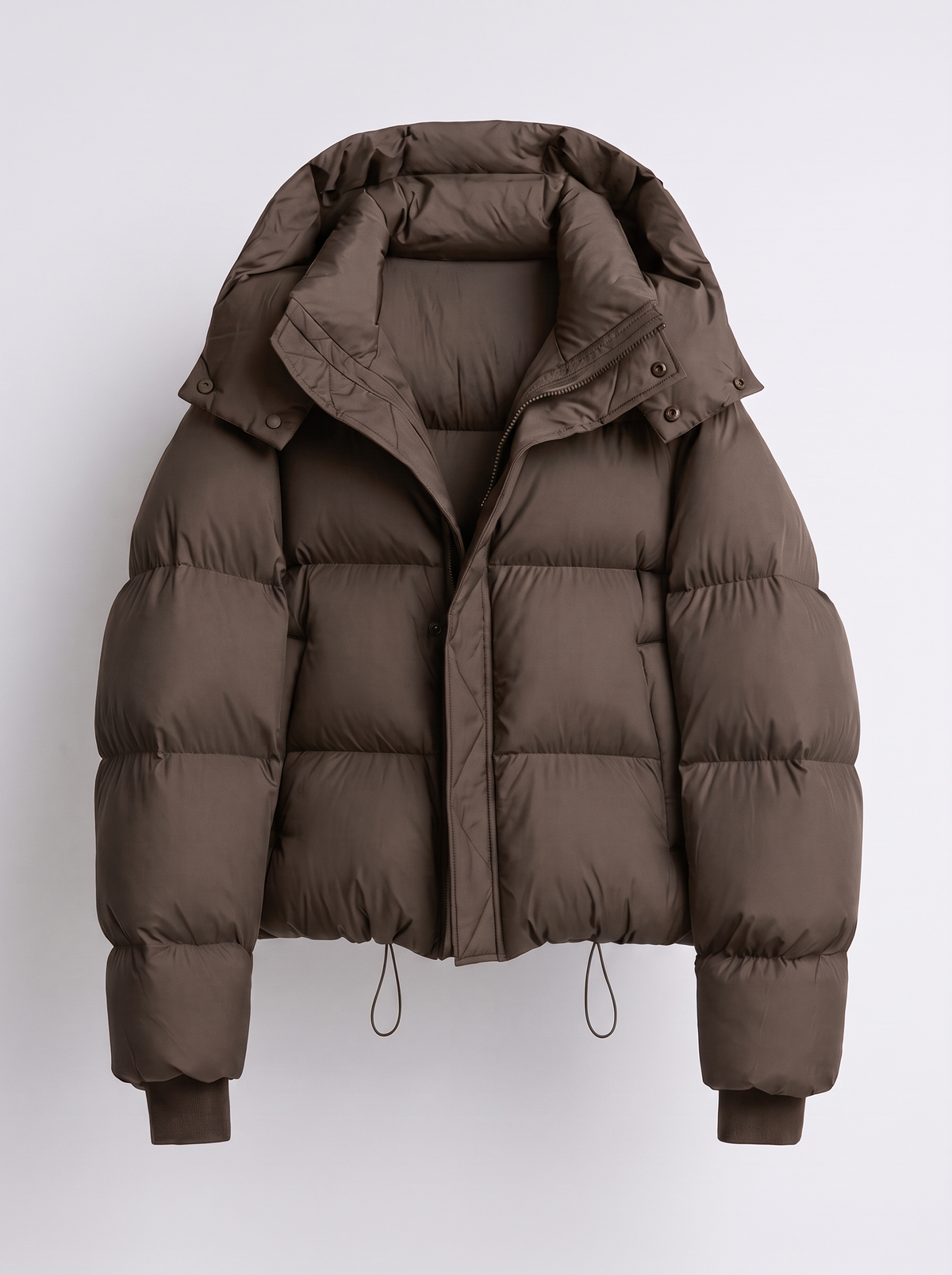 Brown version of the quilted hooded jacket laid flat, showing the front zip, press studs and ribbed cuffs 2
