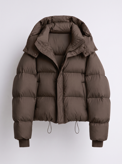 Brown version of the quilted hooded jacket laid flat, showing the front zip, press studs and ribbed cuffs 2
