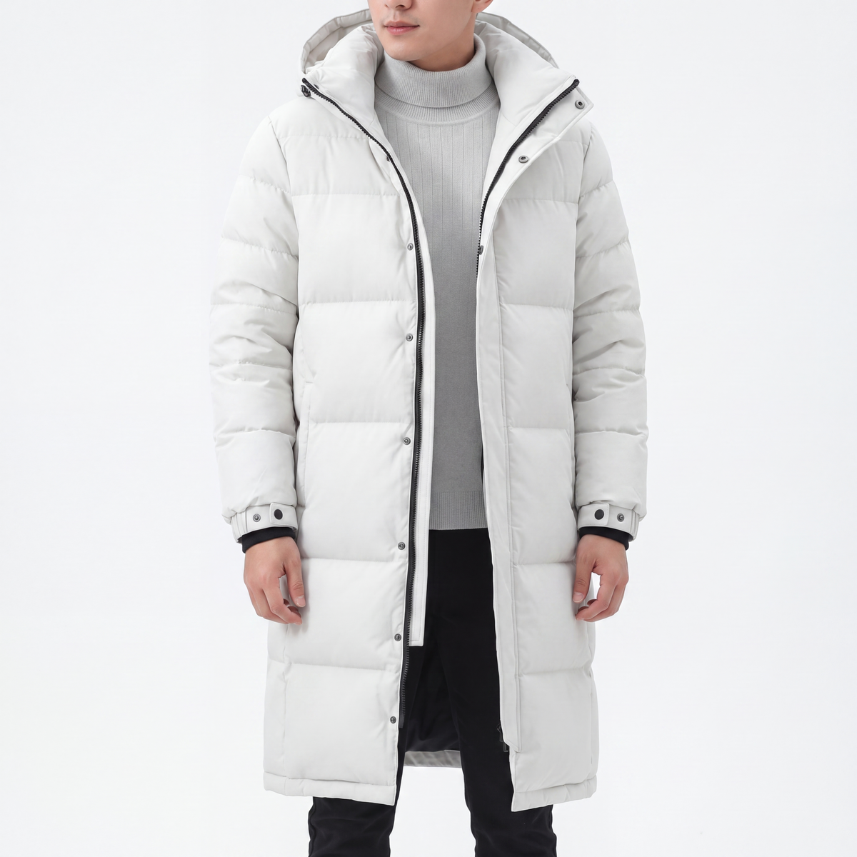 Model wearing the white hooded coat open over a grey ribbed roll-neck jumper and black trousers 6