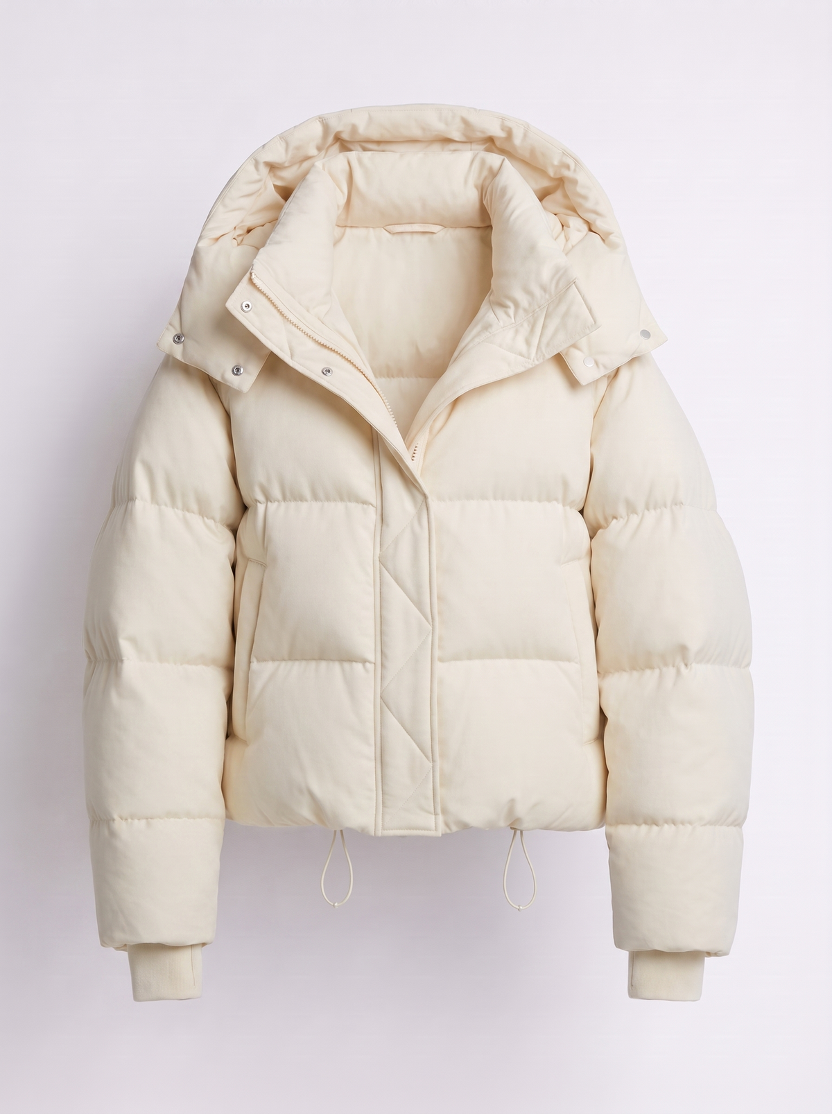 Cream version of the padded hooded jacket laid flat, with silver press studs and drawcord toggles at the hem 3