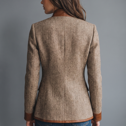 Back view on a model showing the herringbone back panel, tan collar, hem trim and cuffs 3