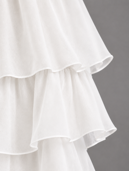Close-up of the layered white organza ruffles with delicate rolled edges. 29