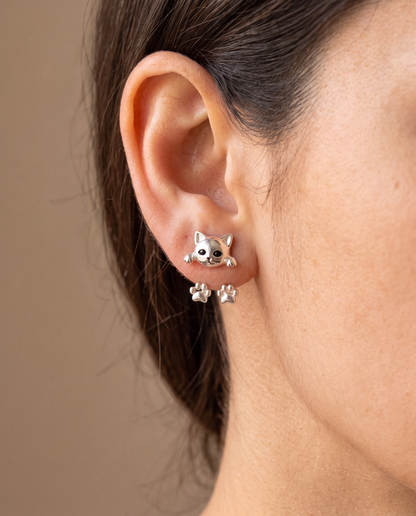 Model's ear wearing one cat earring, with the paw jacket hanging softly behind the lobe 2