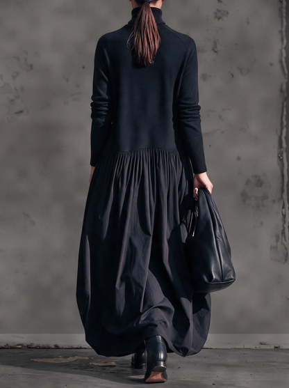Back view of the black dress on a model with a ponytail, showing the gathered waist seam 3
