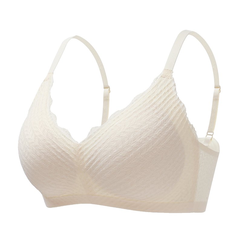 Cream bralette on a plain white background, angled to show the scalloped edge, thin straps and removable-style inner cup. 7