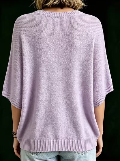 Back view of the lilac knit top, showing the ribbed neckline, wide sleeves and ribbed hem. 9