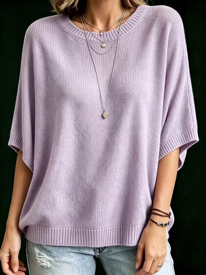Front view of the lilac knit top on a model standing with arms at her sides, showing the ribbed cuffs and hem. 10