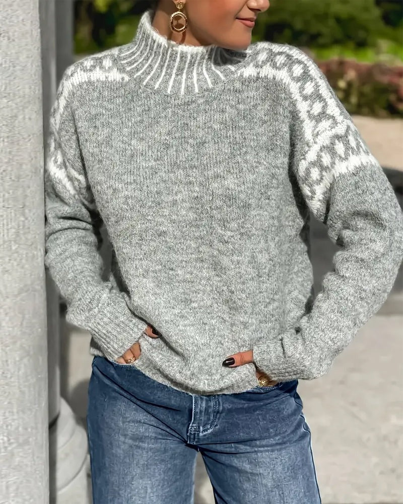 Grey marl knit jumper with high neck and white patterned shoulder yoke, worn with blue jeans outdoors 5