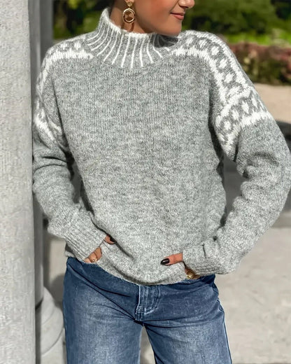 Grey marl knit jumper with high neck and white patterned shoulder yoke, worn with blue jeans outdoors 5