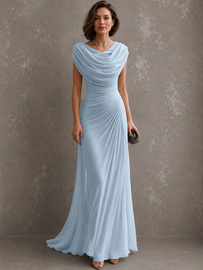 Model wearing the pale blue version of the chiffon maxi dress, showing the cowl neckline, ruched bodice and long flowing skirt. 5