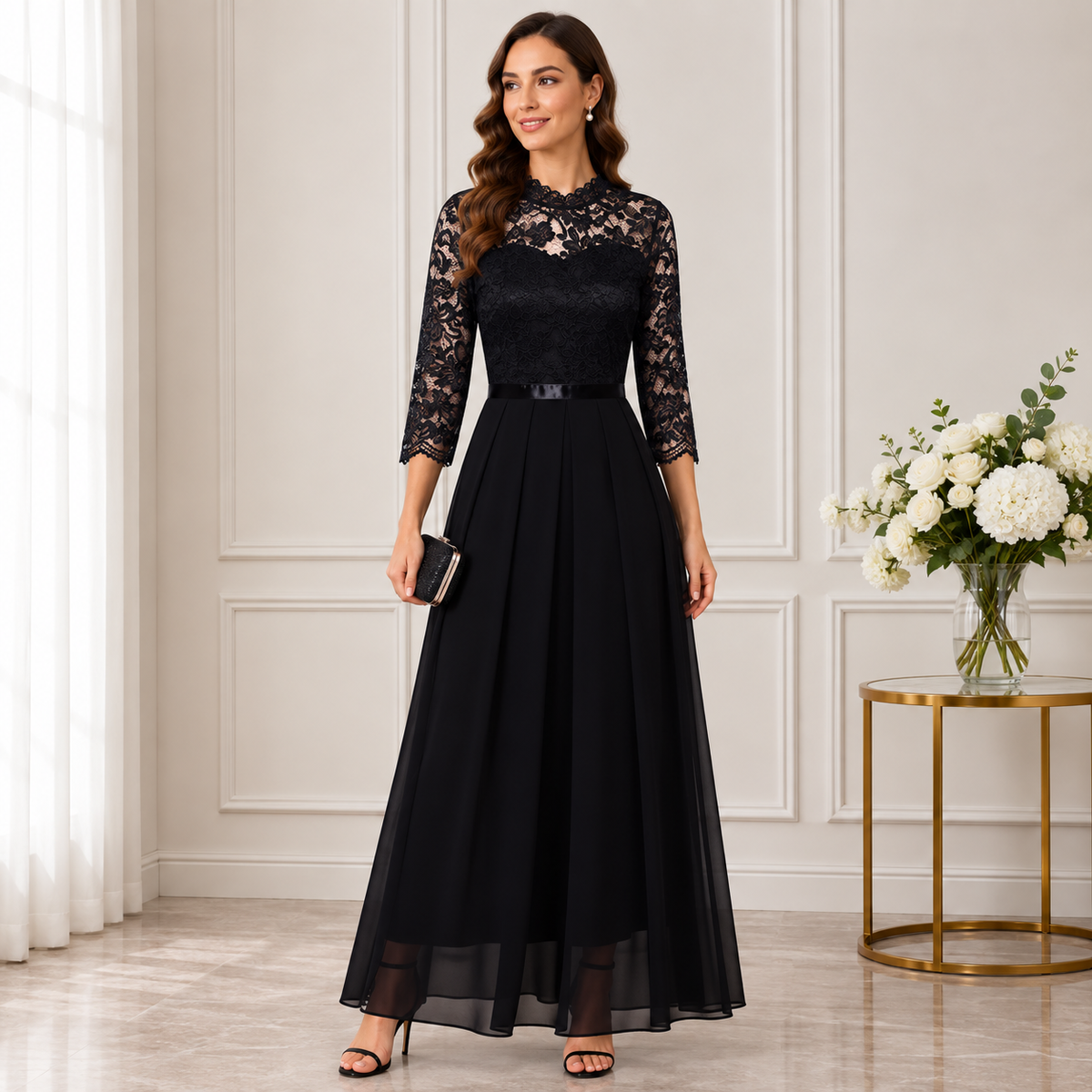 Model in the black version, sheer lace neckline and sleeves above a pleated chiffon skirt 3