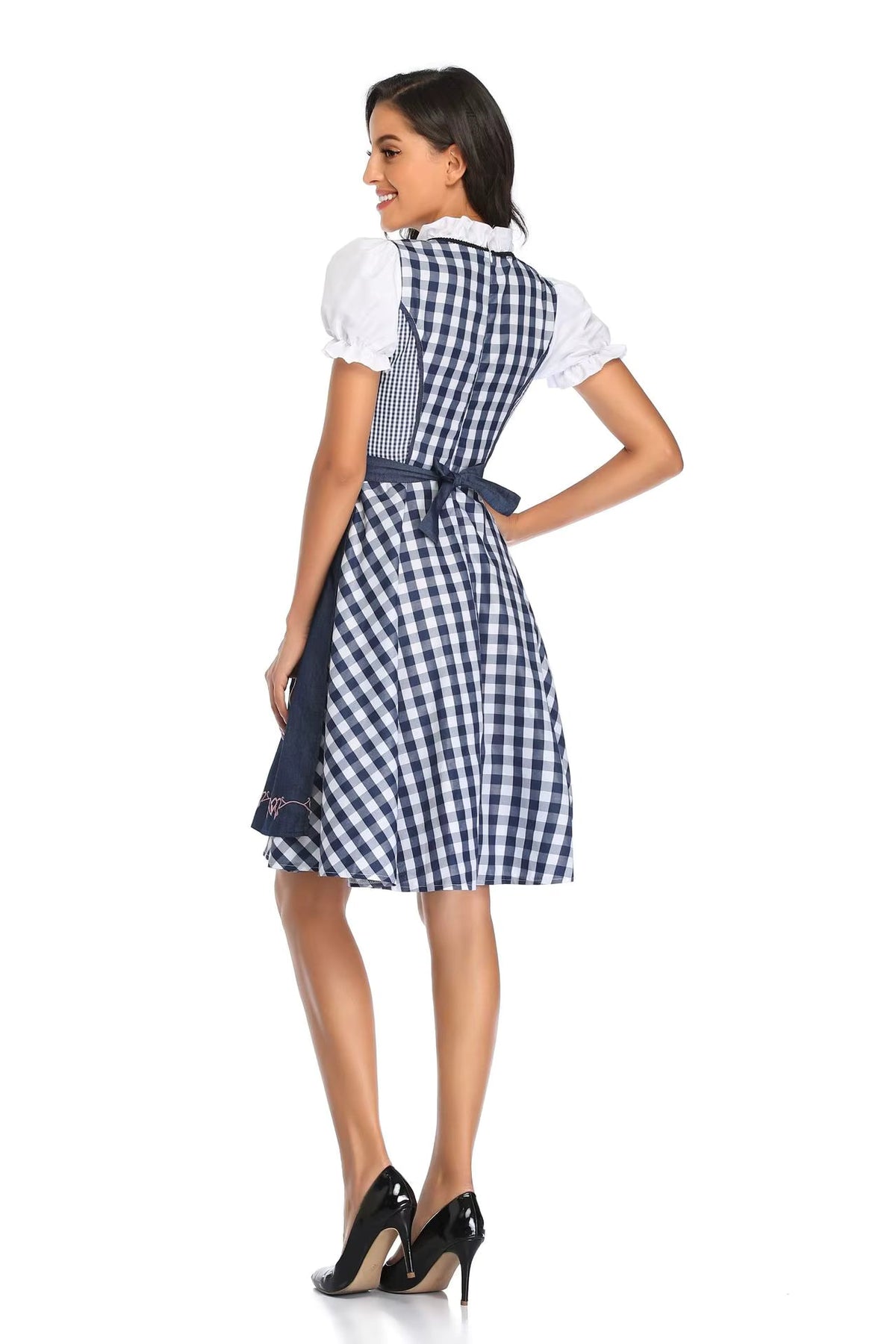 Back view of a navy and white gingham dirndl with a navy apron bow, puff sleeves and a ruffled collar. 6