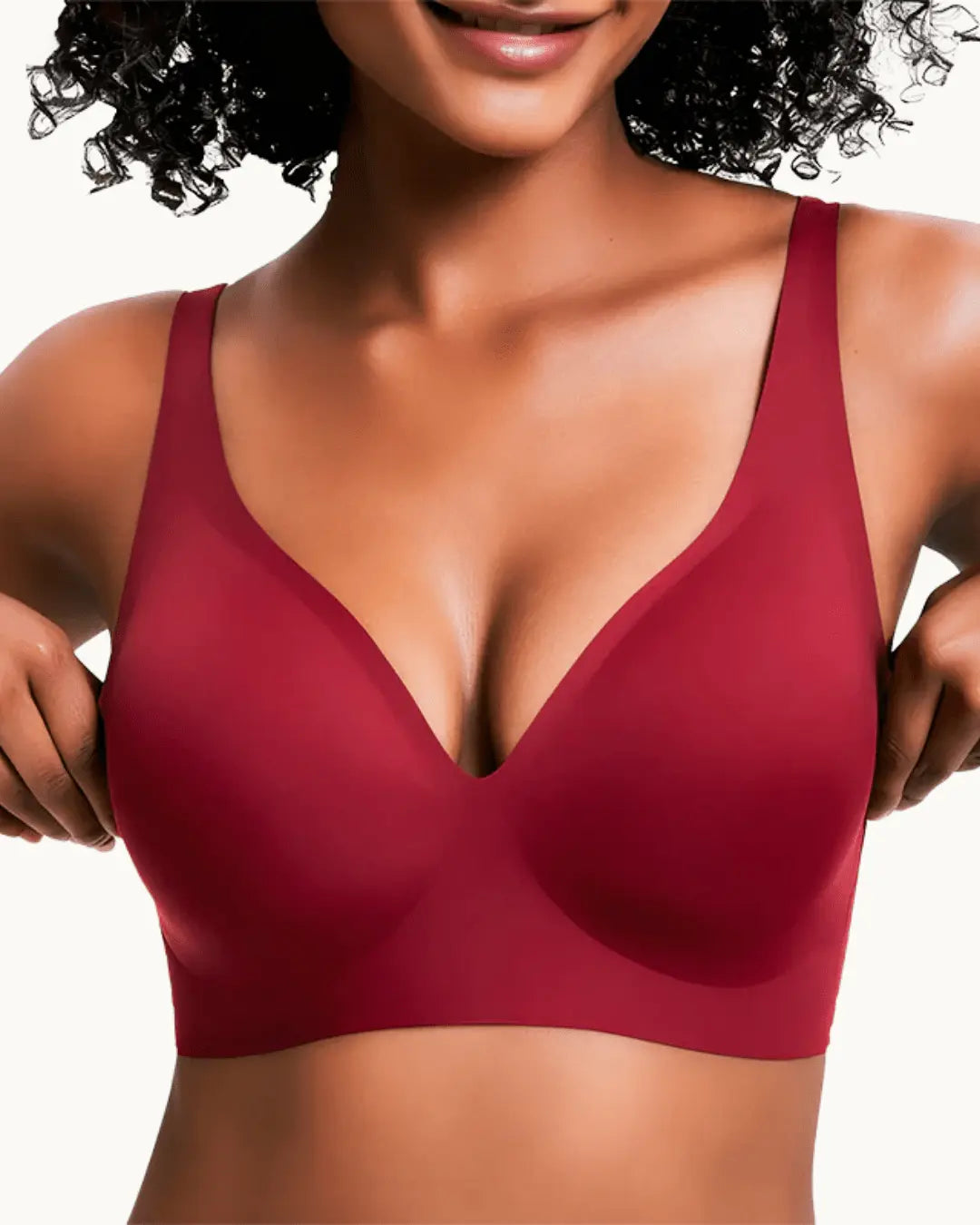 Model wearing the seamless wireless bra in deep red, front view with the deep V neckline. 8