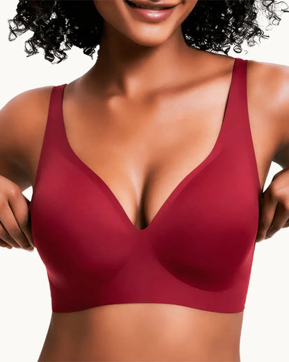 Model wearing the seamless wireless bra in deep red, front view with the deep V neckline. 8