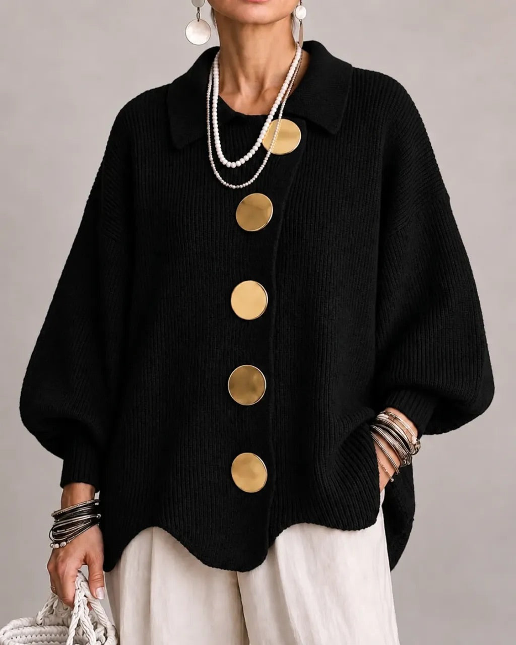 Black version worn with cream trousers, gold buttons standing out against the dark ribbed knit 8