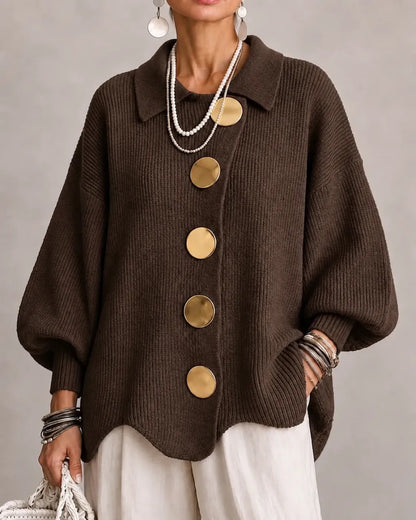 Dark chocolate brown version with gold buttons, worn with cream trousers and layered pearls 9