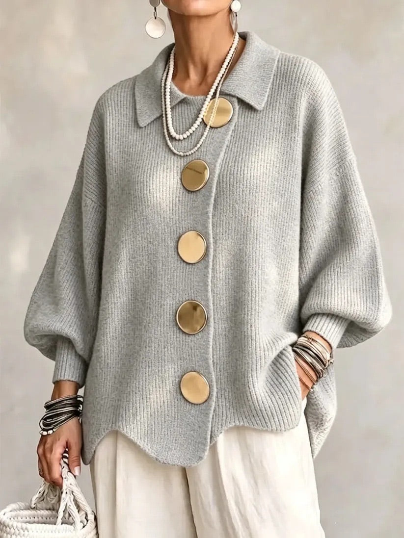 Light grey version worn by a model, with wide lantern sleeves and a wavy hem 10