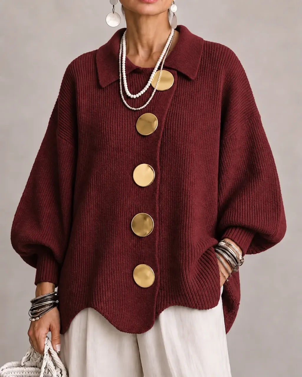 Burgundy version worn with cream trousers, showing gold buttons and ribbed lantern sleeves 19