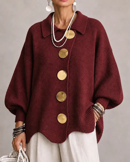 Burgundy version worn with cream trousers, showing gold buttons and ribbed lantern sleeves 19