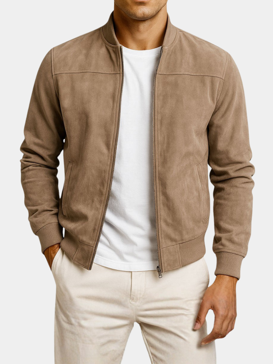Tan jacket worn open on a plain white background, showing the shoulder seams, zip pockets and ribbed hem. 6