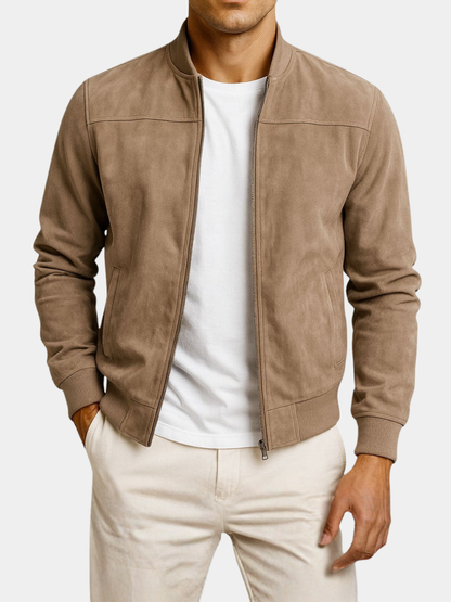 Tan jacket worn open on a plain white background, showing the shoulder seams, zip pockets and ribbed hem. 6
