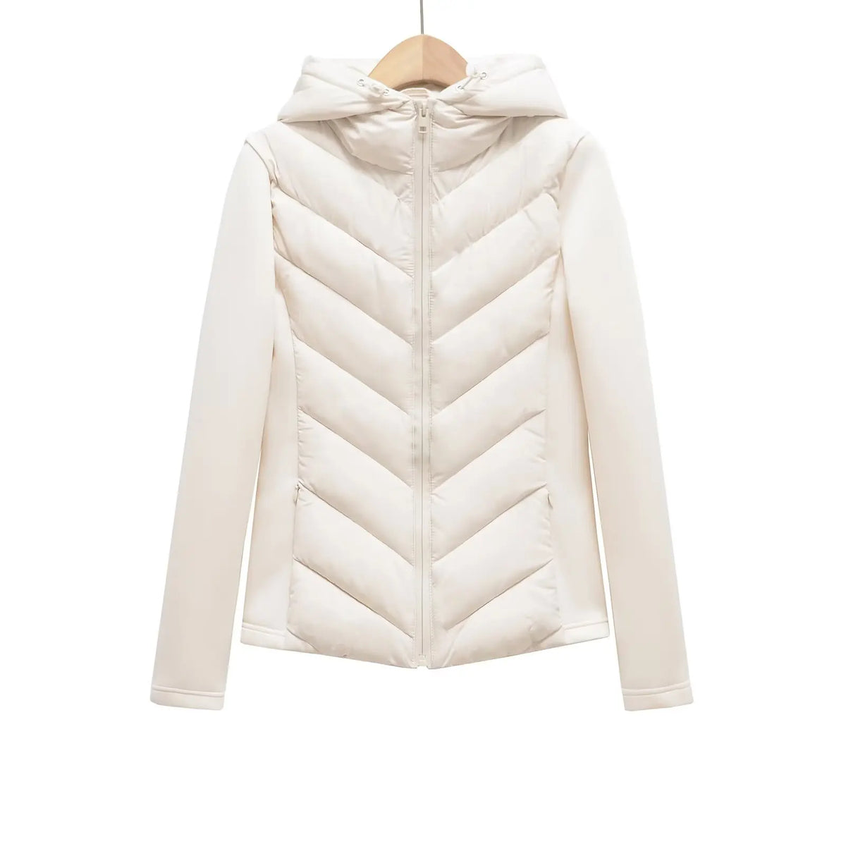 Cream hooded padded jacket with chevron quilting and fabric sleeves, hanging on a wooden hanger, seen from the front. 2