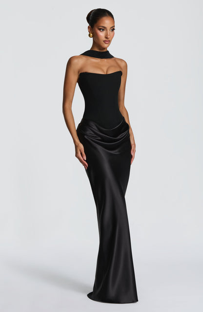 Black strapless corset dress with satin cowl skirt, three-quarter view, with a detachable high collar band 21