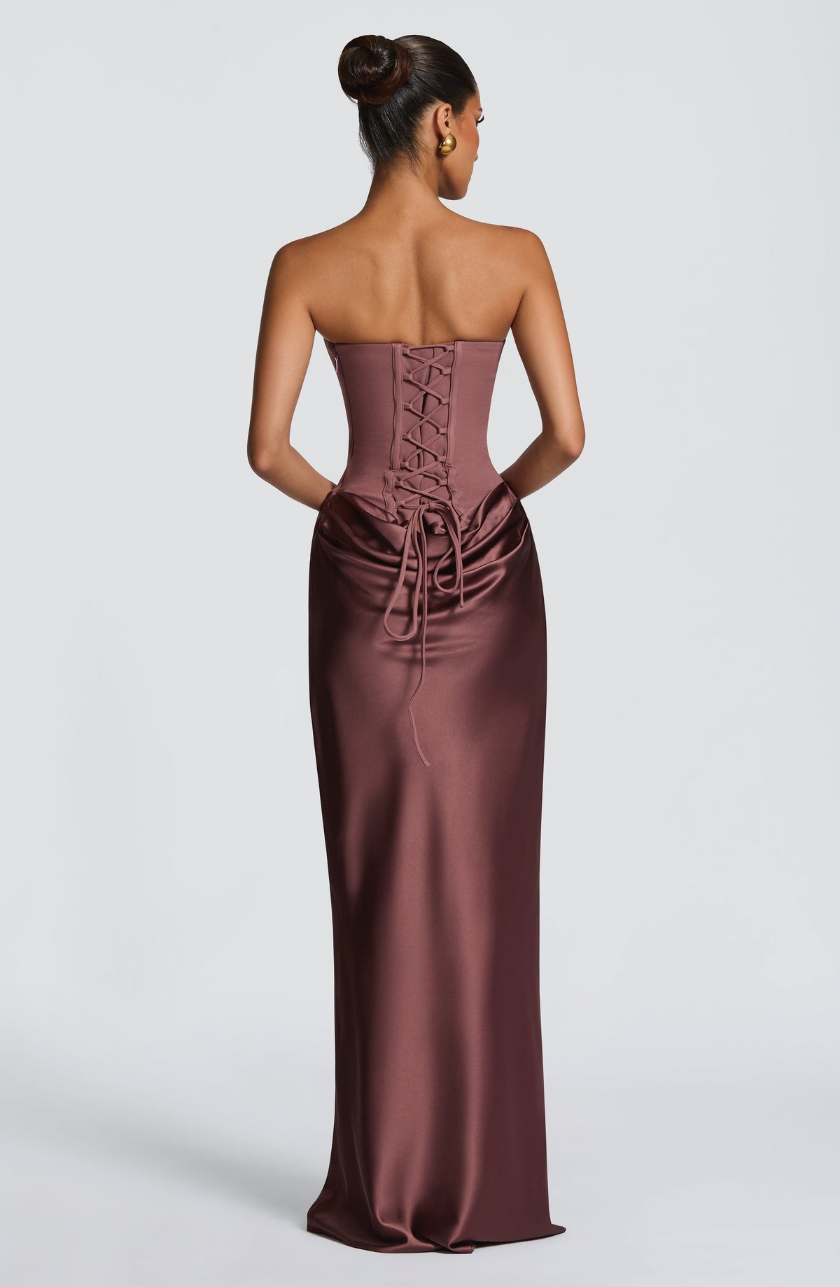 Back view of the brown dress showing the corset lacing and long ties over the draped skirt 38