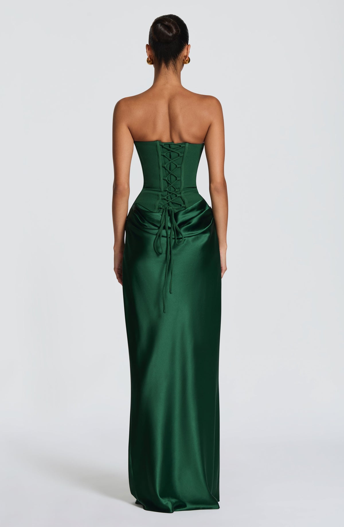 Back view of the green dress showing the lace-up corset back and trailing ties 30