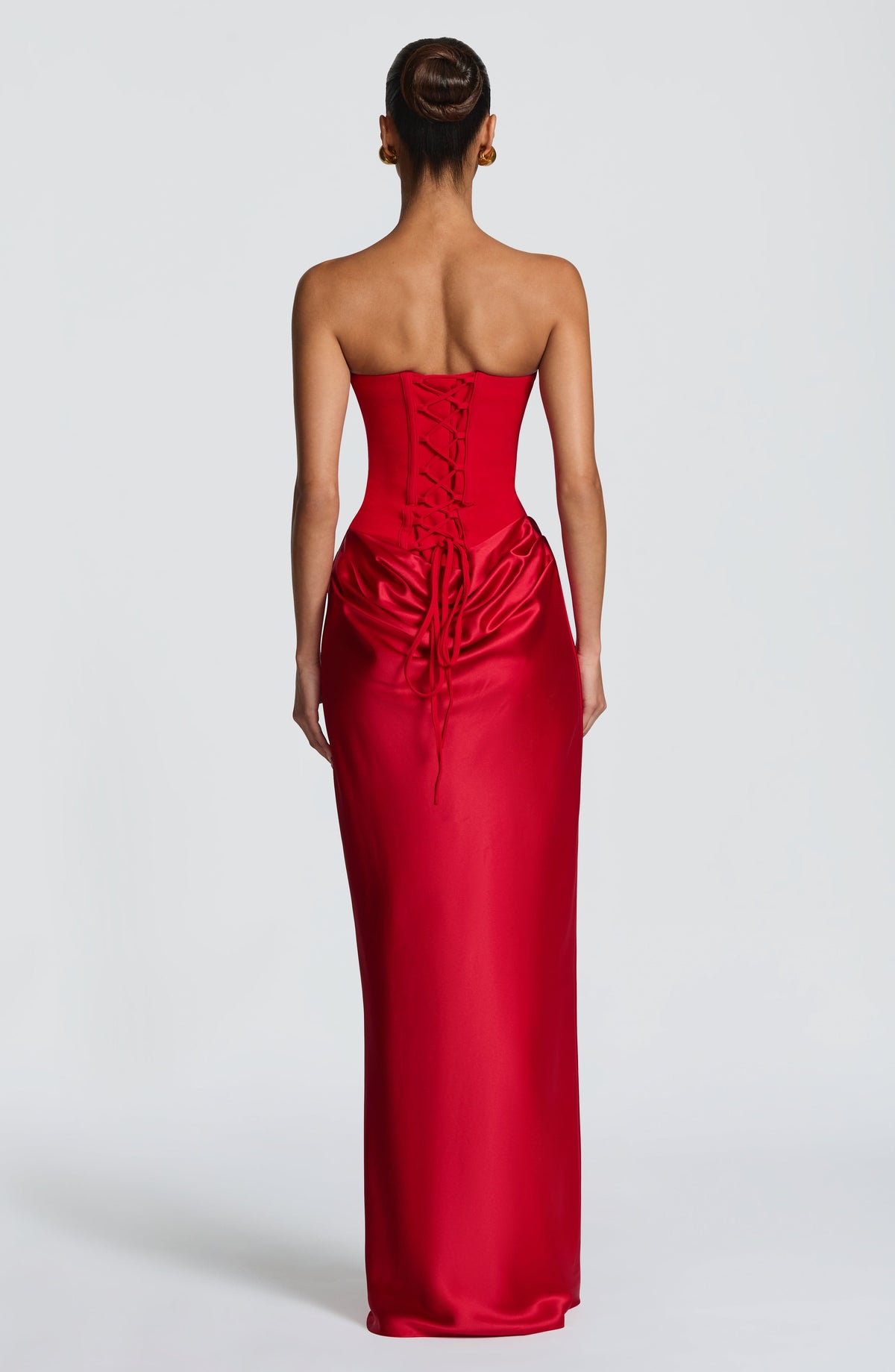 Back view of the red dress showing the corset lacing and long ties over the satin skirt 12