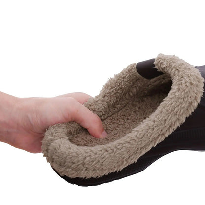 Hand pressing into the soft beige fleece lining inside a dark clog 5