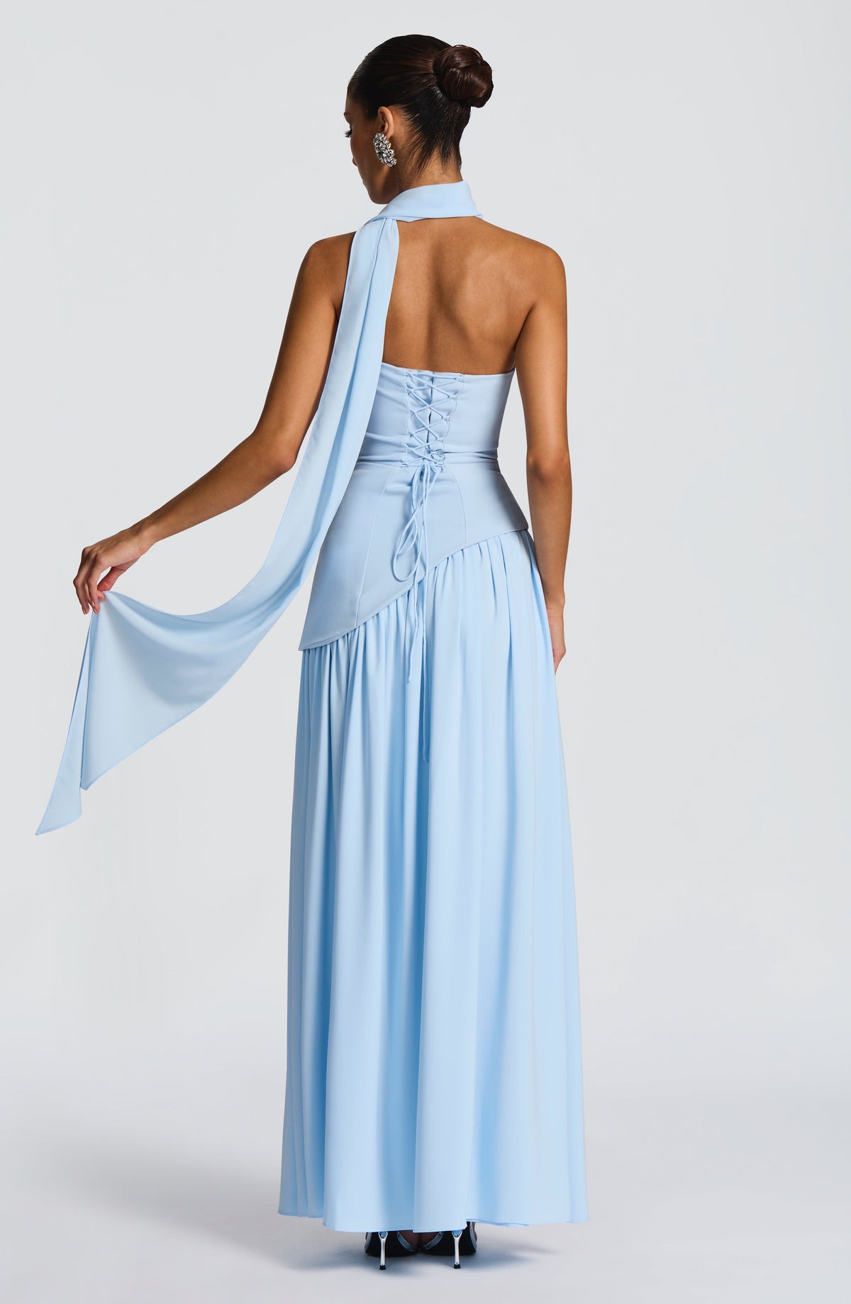 Back view of pale blue dress with corset lacing and a long scarf trailing from the neck 26