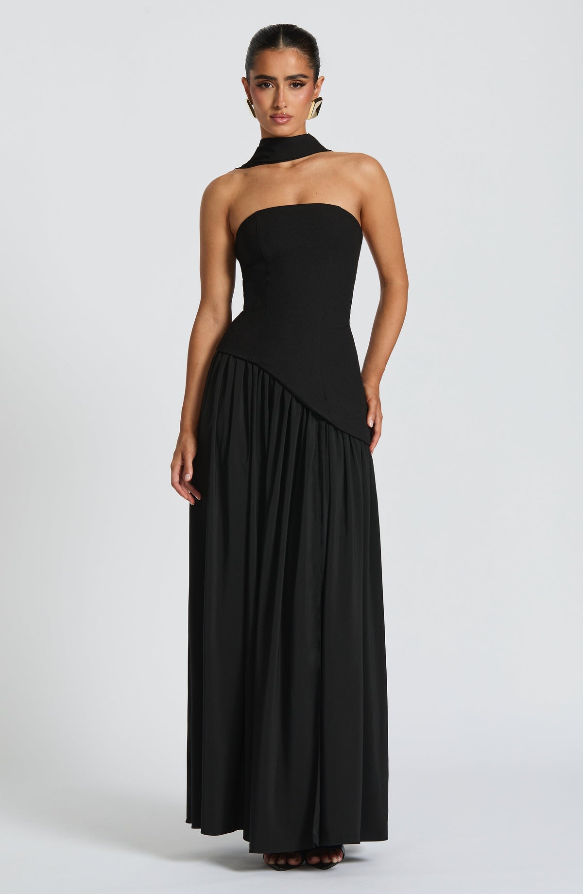 Front view of black strapless maxi dress with neck scarf, asymmetric waist and gathered full skirt 8