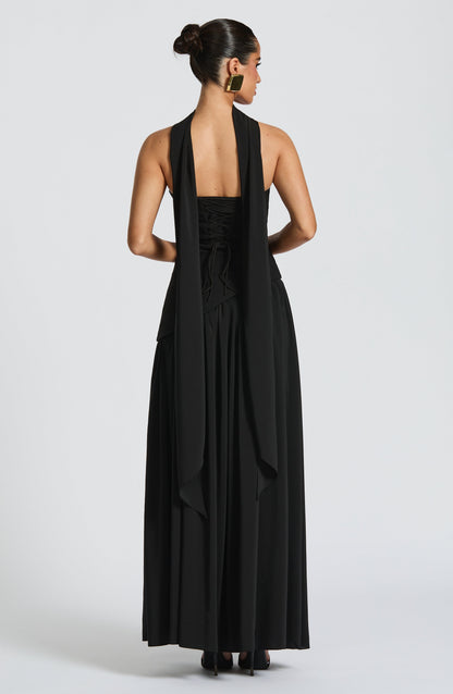 Back view of black maxi dress with scarf draped down the back above lace-up corset detail 9