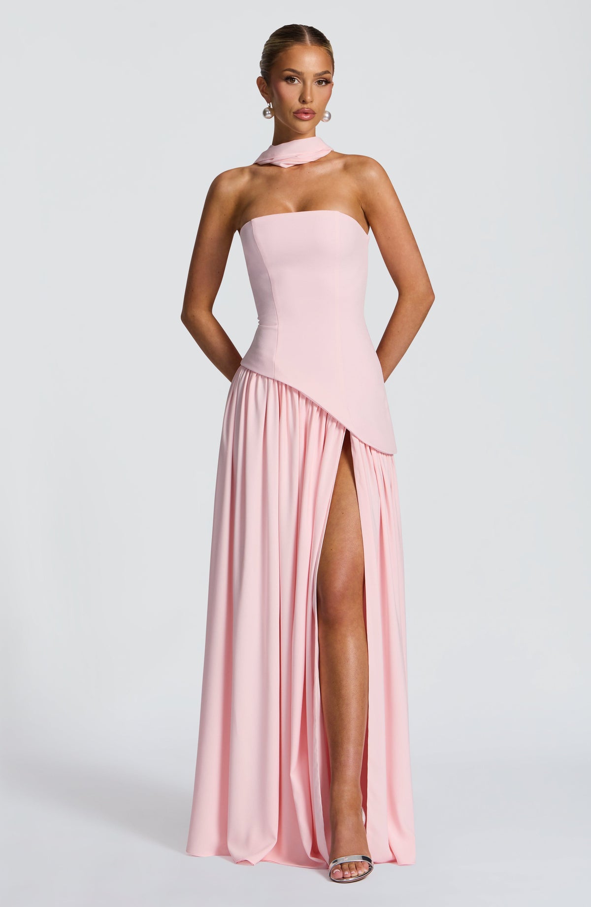 Front view of light pink strapless maxi dress with neck scarf, asymmetric waist and gathered skirt with high slit 20