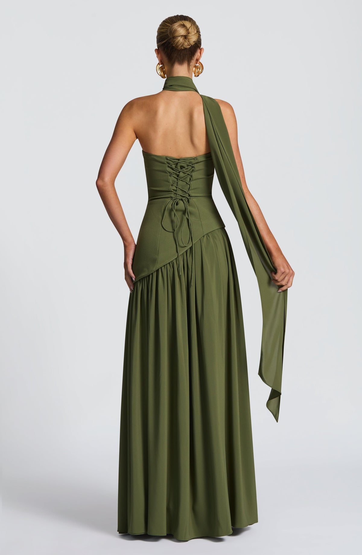 Back view of olive green dress with corset lacing and a long draped scarf 32