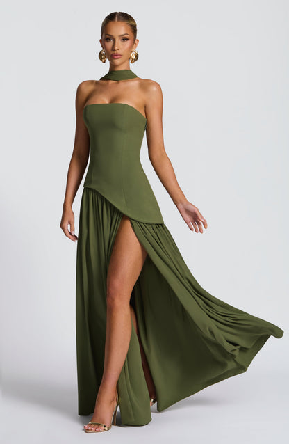 Olive green dress showing a flowing, gathered skirt with high slit in movement 31